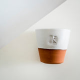 Oval ‘K’ terracotta beakers